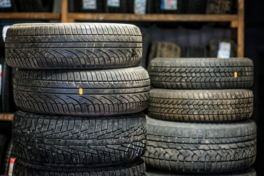 A selection of used tires for sale, featuring different tread patterns.
