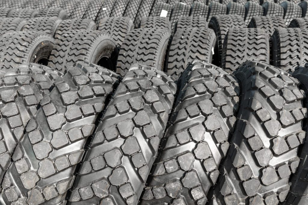 Various types of tires displayed for commercial truck tire replacement selection.